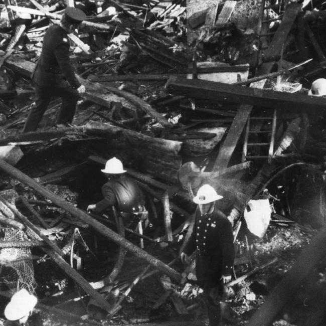 Investigators at the scene of the ghost train fire at Sydney's Luna Park in 1979.