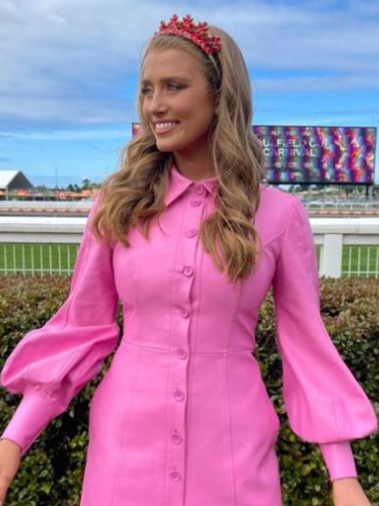 Grace Hayden, a 7 Racing reporter, bold pink button up dress with puff sleeves from Leon Lin. Picture: Instagram/Grace Hayden