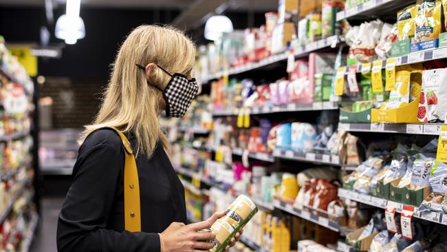 Shoppers pictured wearing masks at Woolworths Bondi on Monday. Picture: Monique Harmer