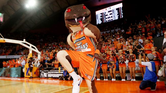 Always keen to dish out punishment to visiting teams, Taipans mascot Joe Blake was on the receiving end in 2003 when a fan ran on to the playing arena and crash-tackled him. PICTURE: STEWART McLEAN.