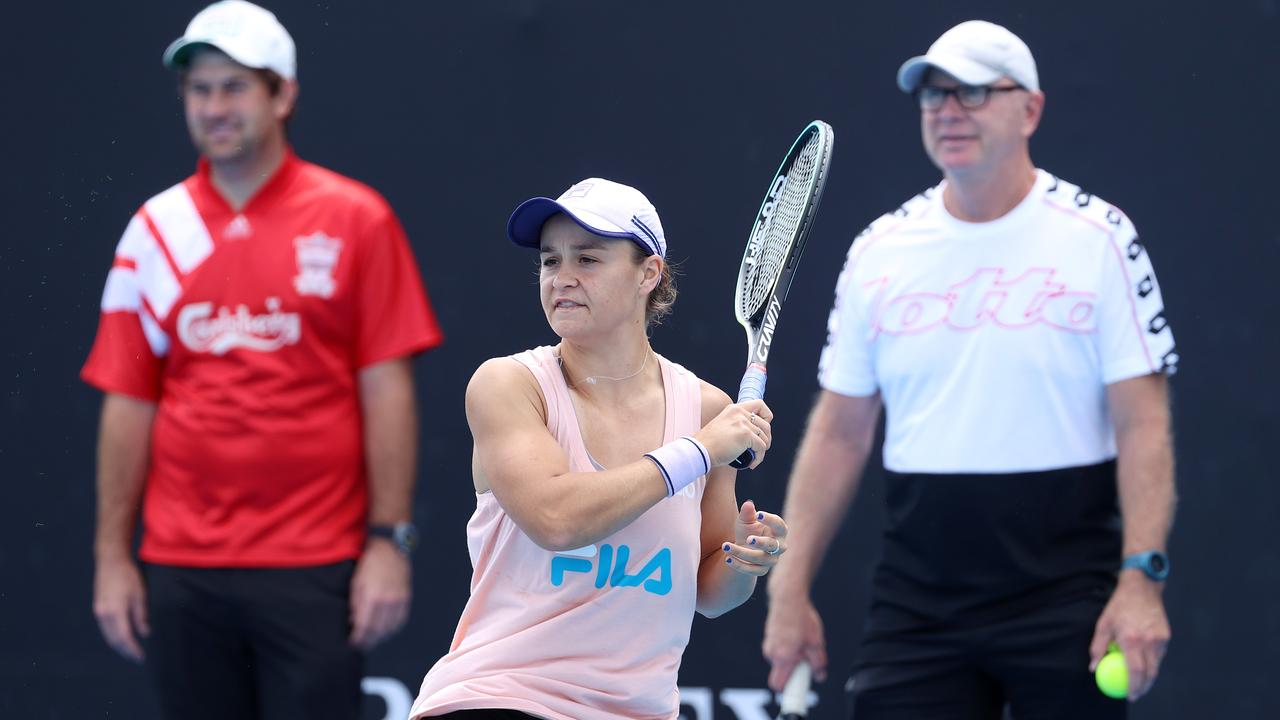 At the 2021 Australian Open, Ash Barty goes through her paces under the watchful eye of coach Craig Tyzzer and husband Gary Kissick. Picture: Michael Klein.