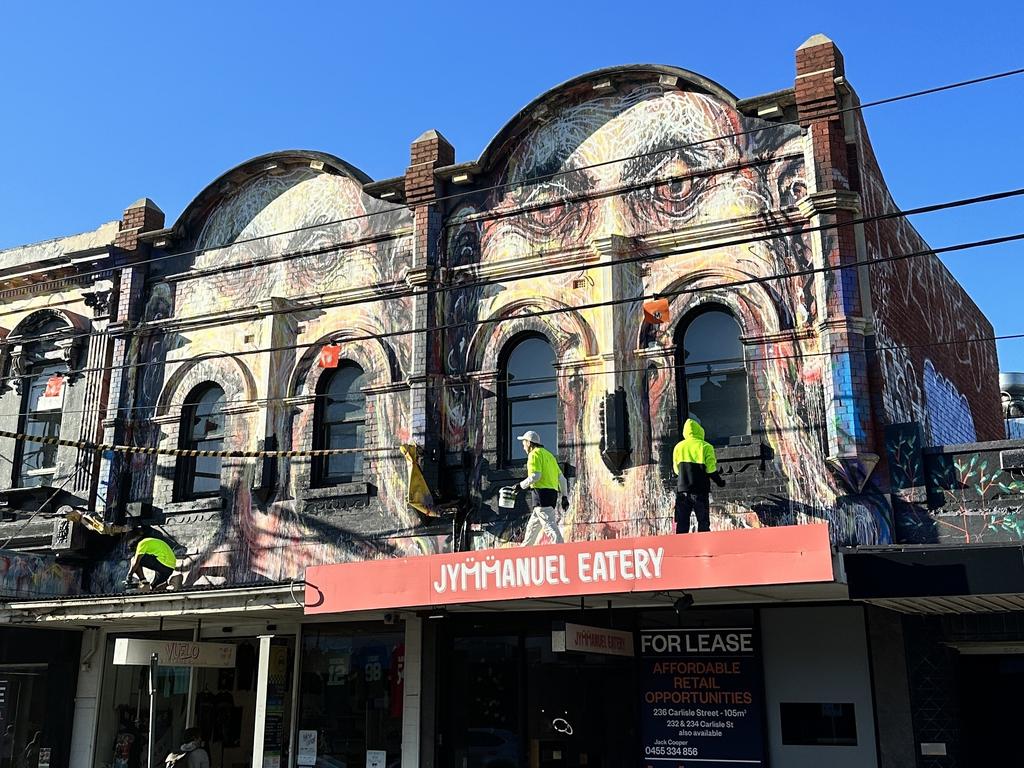 Port Phillip Council works to remove a mural in Balaclava. Picture: Lauren Hutchinson