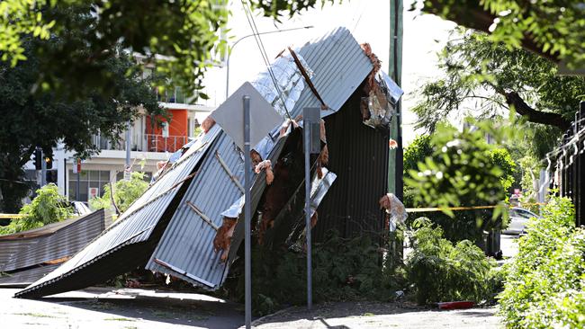 Part of the hall roof lands at Albert St. Picture: Adam Yip