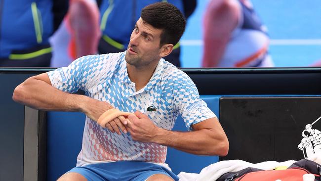 Novak Djokovic takes rest between the break during his third-round victory over Bulgaria's Grigor Dimitrov. Picture: AFP