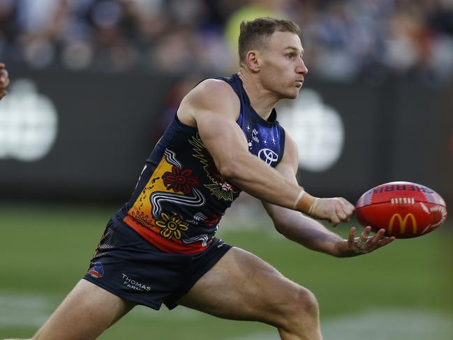 MELBOURNE , AUSTRALIA. May 18, 2024.  AFL round 10Ã  Collingwood vs Adelaide at the MCG .   Rory Laird of the Crows clears by hand during the 4th qtr.    . Pic: Michael Klein