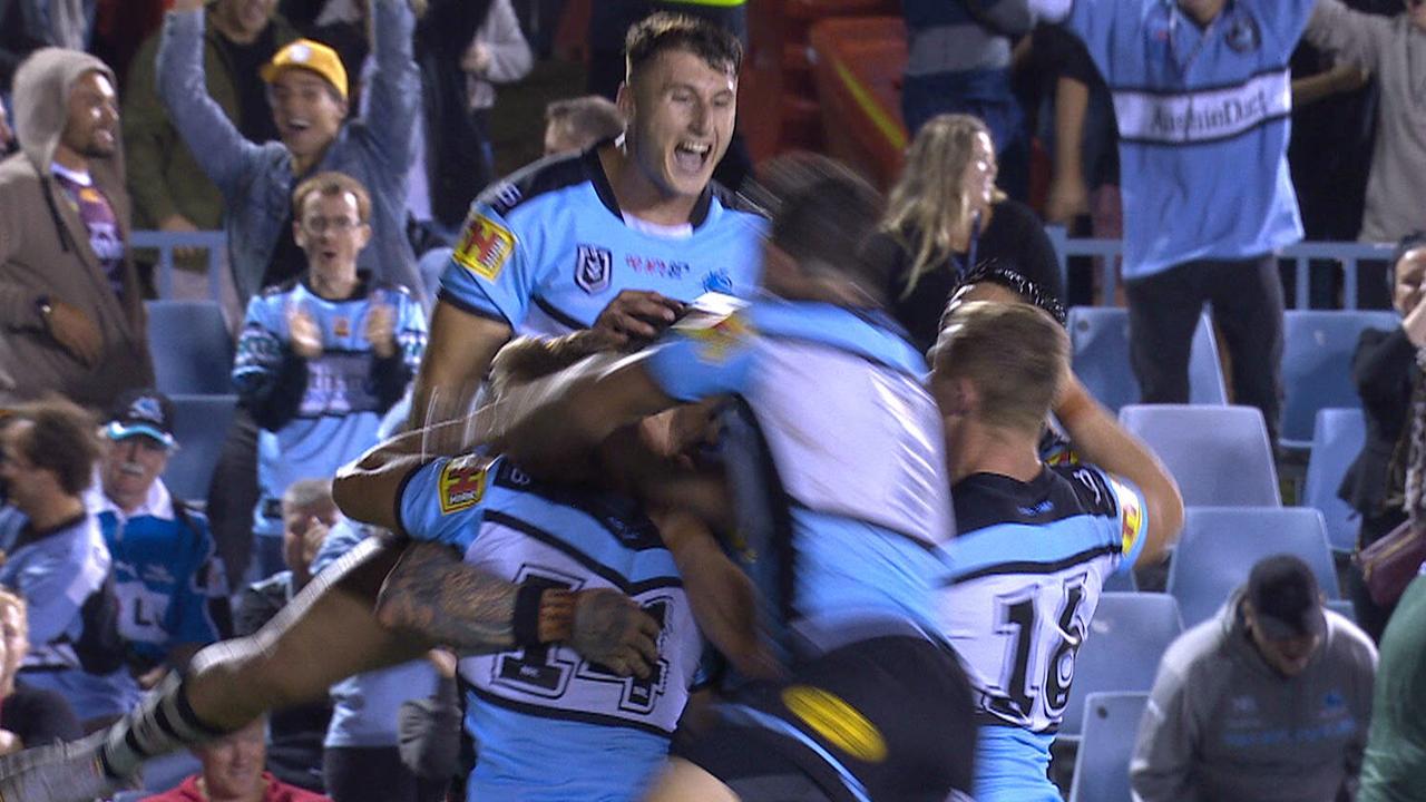 Sharks winger Josh Dugan celebrates his match winning try with teammates. 