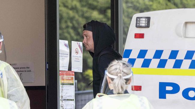 A man is transferred to the Fountainside Accommodation in Hobart. Picture Eddie Safarik