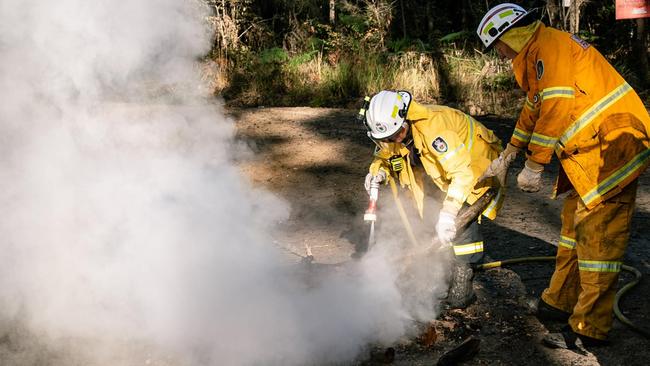 Rural Fire Service volunteers extinguish a 'sacred fire' at the anti-logging protest at Newry State Forest. Picture: Facebook