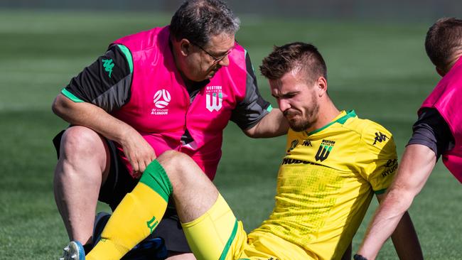 Filip Kurto is assisted by trainers after a heavy fall. Picture: Sue McKay/Getty Images.