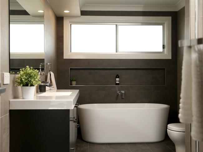 Separate bath and shower in the family bathroom.