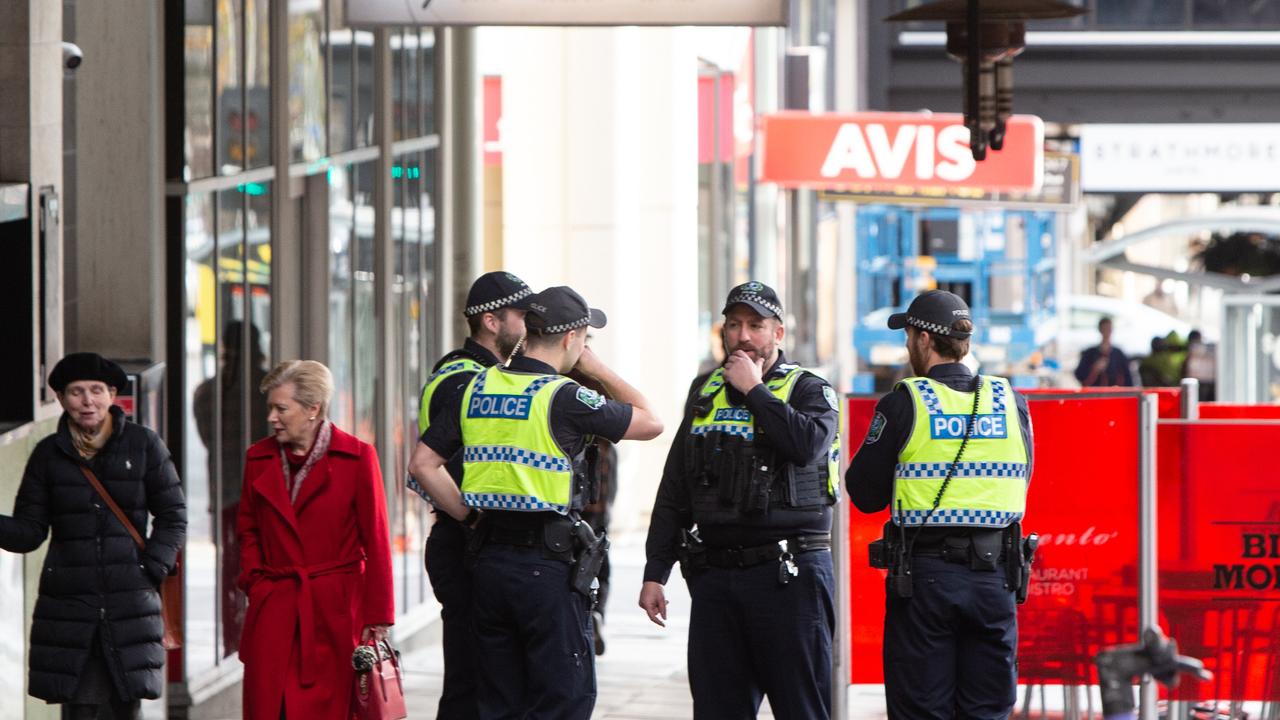 Officers on North Tce near Adelaide Railway station. Picture: Brett Hartwig