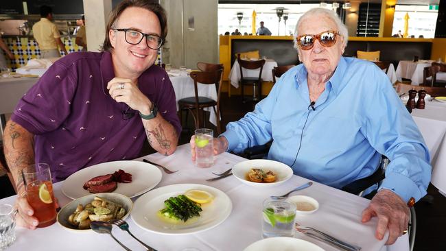 Journalist Jonathan Moran with John Laws. The radio personality does not reflect on the past but focuses on the future. Picture: Tim Hunter