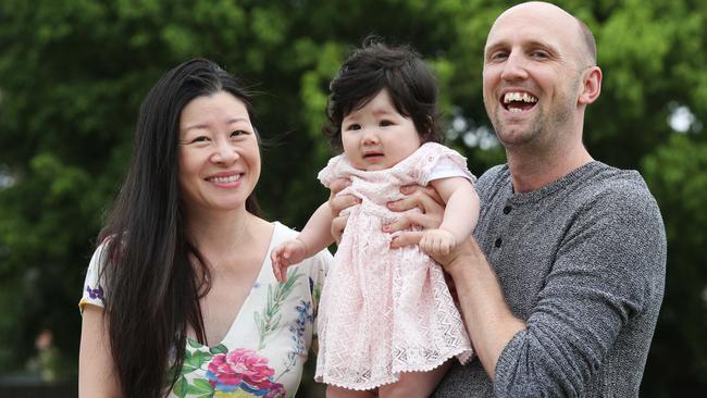 Luke Poliszcuk and partner Joanne Kim and their seven-month-old daughter Lily Kim Poliszcuk are one of the first customers to of a new electricity service which offers monthly rates for set amounts of usage. Picture: David Swift.