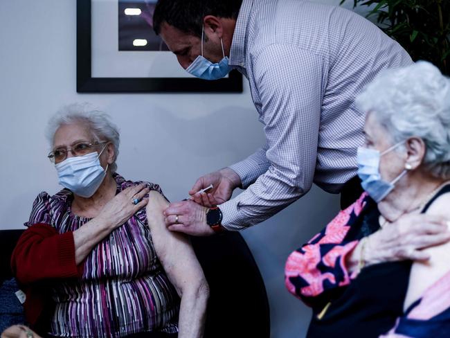 A resident of the Christalain nursing home in Brussels receives a dose of Pfizer-BioNTech Covid-19 vaccine. Belgium is on “red alert” says its Prime Minister. Picture: AFP