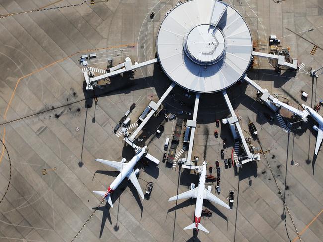 DO NOT USE BEFORE DEC 28TH, CONTACT COURIER MAIL PIC DESK Aerial images over Brisbane in summer. Qantas planes at Brisbane Domestic Airport.