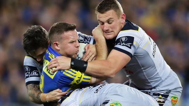 Eels lock Nathan Brown is wrapped up by the Cowboys defence at ANZ Stadium.