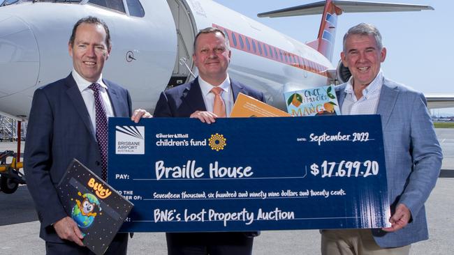 News Corp Queensland and NT managing director Jason Scott, Brisbane Airport chief executive Gert-Jan de Graaff and Richard Barker of Braille House. Picture: Jerad Williams