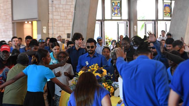 Willie Rioli Junior does a traditional Tiwi dance for Willie Rioli Senior's funeral service. Picture: (A)manda Parkinson