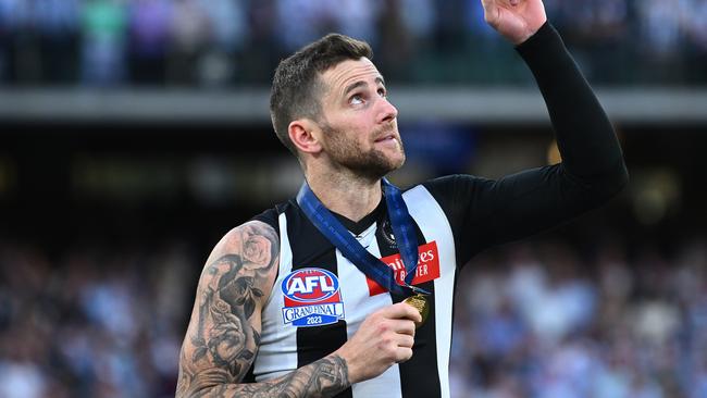 MELBOURNE, AUSTRALIA - SEPTEMBER 30: Jeremy Howe of the Magpies celebrates getting his Premiership medal during the 2023 AFL Grand Final match between Collingwood Magpies and Brisbane Lions at Melbourne Cricket Ground, on September 30, 2023, in Melbourne, Australia. (Photo by Quinn Rooney/Getty Images)