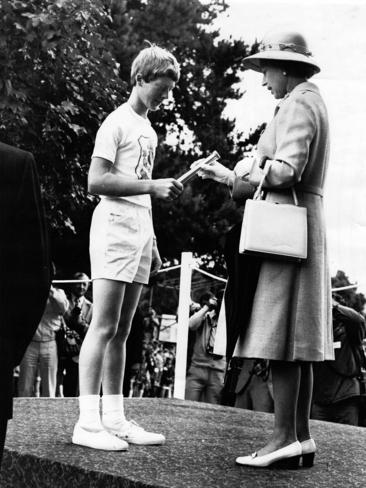 Queen Elizabeth II receives a message from Andrew Page of the Tasmanian Boys Brigade during her silver jubillee visit to Tasmania in March 1977.