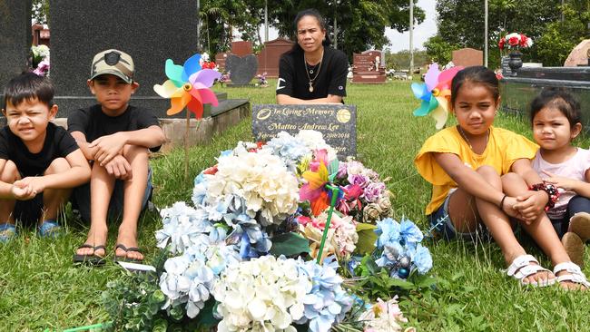 Chantelle Lee, with her children, around the grave of her son Matteo who died by suicide in 2018. Chantelle paid a $6000 deposit to a company that failed to produce the headstone. Picture: Katrina Bridgeford.