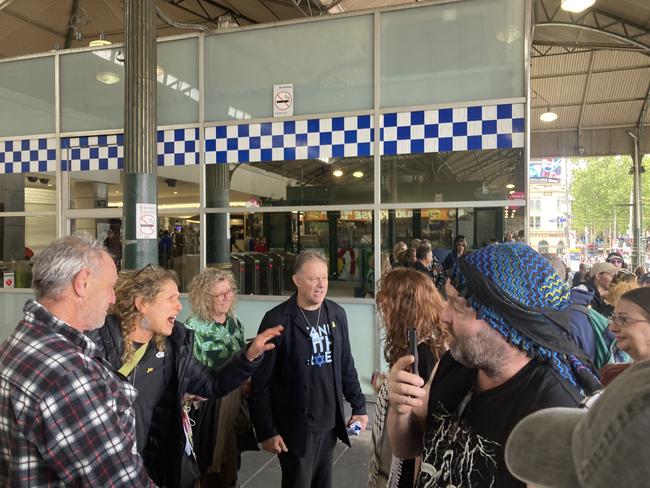 Pro-Palestine protesters clash with a man wearing an ‘I Stand With Israel’ T-shirt. Picture: Angus McIntyre