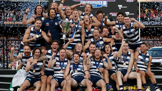 MELBOURNE, AUSTRALIA - SEPTEMBER 24: The Cats celebrates on the dais during the 2022 Toyota AFL Grand Final match between the Geelong Cats and the Sydney Swans at the Melbourne Cricket Ground on September 24, 2022 in Melbourne, Australia. (Photo by Michael Willson/AFL Photos via Getty Images)