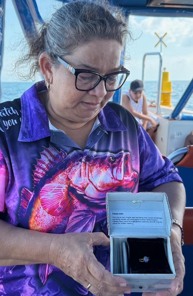 Georgia Vincent with her mother’s ring recovered when the wreck of the Booya was first found. Divers have visited the wreckage of a boat that sank during Cyclone Tracy 50 years ago to lay a wreath for five people on-board the Booya who died during the storm, including Ruth Nazmeena Vincent. Picture: Supplied.