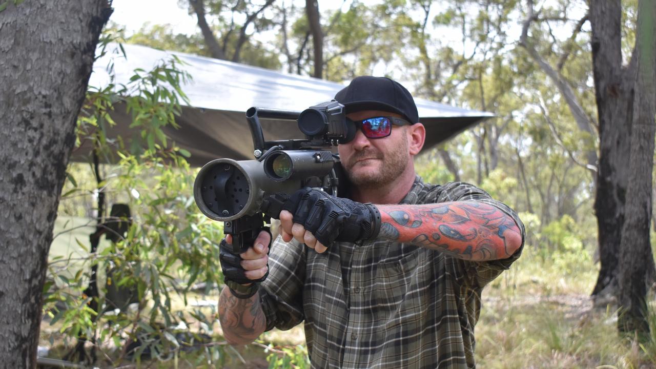 OPERATION TEMPEST: David Peters from Brisbane poses with a prop rocket launcher during Operation Tempest on the Fraser Coast. Photo: Stuart Fast