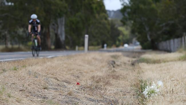 Flowers left at the scene where cyclist Kathleen Heraghty was fatally hit by a car on Inman Valley Rd. Picture: Tait Schmaal.