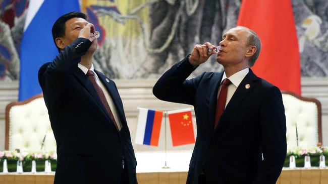 President of Russia Vladimir Putin and Chinese President Xi Jinping toast during a signing ceremony for a gas contract in Shanghai, China, in 2014. Picture: Getty