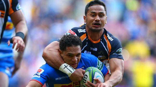 Toni Pulu of the Brumbies tackles Herschel Jantjies of the Stormers.