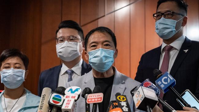 Pro-democracy legislators Helena Wong, left, Wu Chi-wai, Andrew Wan Siu-kin and Lam Cheuk-ting after tendering their letters of resignation at the Legislative Council in Hong Kong on Thursday. Picture: Getty Images