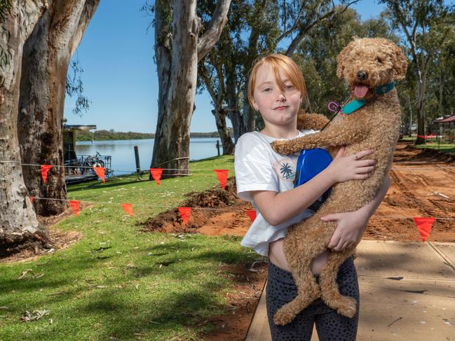 November 24, 2022: Kids at Mannum talk about the impending floods - Layla Barney, 10 with her dog Coco. Picture: Naomi Jellicoe