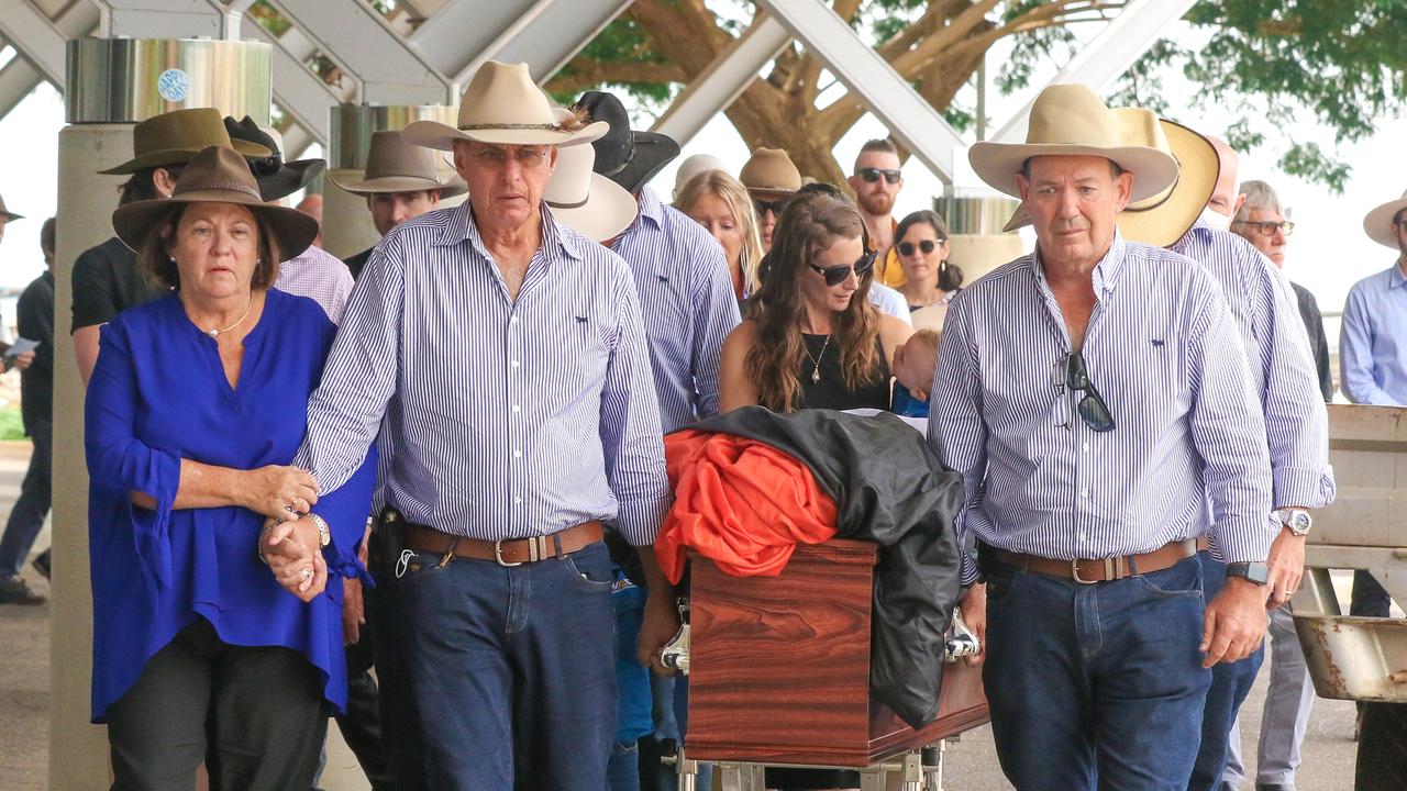 Sharon and Bob Wilson (L) along with local businessman Mick Burns bear away the casket of their son and mate, Chris Wilson. Picture: Glenn Campbell