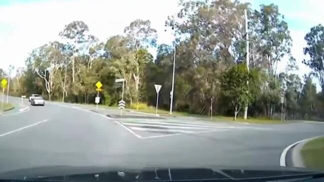 Ute driving on wrong side of road outside school