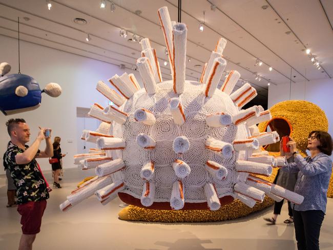 MELBOURNE, AUSTRALIA - DECEMBER 17: People take photos of some of the installations during the NGV Triennial Media Preview at NGV International on December 17, 2020 in Melbourne, Australia. (Photo by Darrian Traynor/Getty Images)