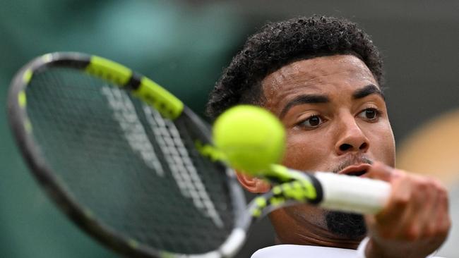 Arthur Fils returns against Alex de Minaur. Picture: Glyn Kirk/AFP