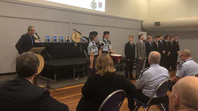 Police Minister Mark Ryan with Macalister MP Melissa McMahon and Chief Superintendent Brian Swan watch as the eight Booyah Boys graduate at Tudor Park PCYC.