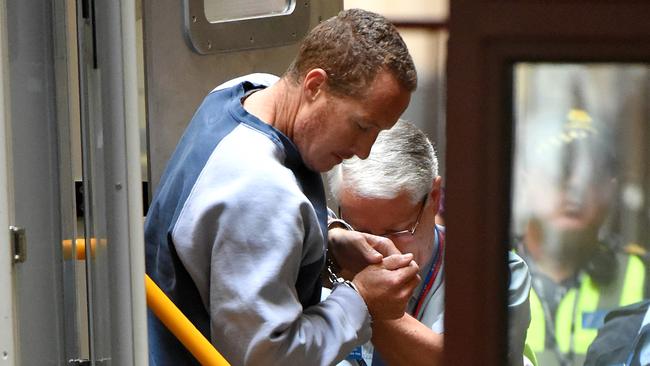 Tim Baker arrives in the prison van. Accused murderer and police officer Tim BAKER to apply for bail at Supreme Court. Baker's been in suicide watch. ID confirmed David Hurley. Picture: Nicole Garmston