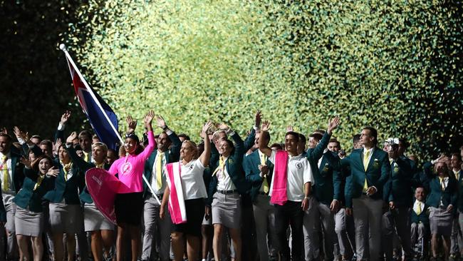 GOLD COAST, AUSTRALIA - APRIL 04: Mark Knowles, flag bearer of Australia arrives with the Australia team during the Opening Ceremony for the Gold Coast 2018 Commonwealth Games at Carrara Stadium on April 4, 2018 on the Gold Coast, Australia. (Photo by Ryan Pierse/Getty Images)