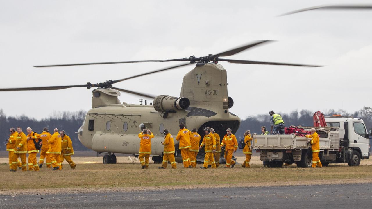 Victorian CFA firefighters arrive on an Australian Army CH-47 Chinook helicopter at Mallacoota. Picture: Supplied