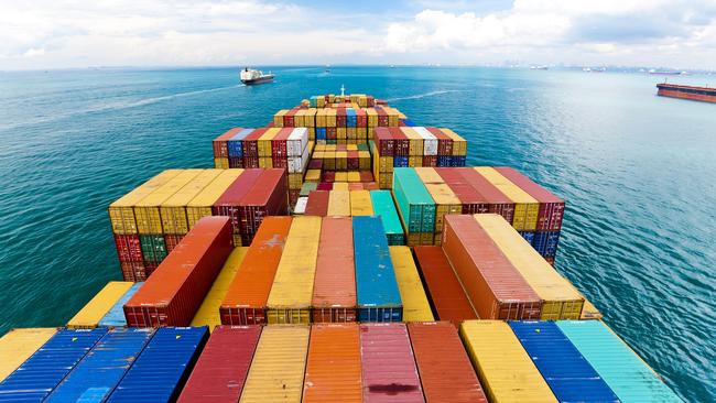 A cargo ship transits the busy Strait of Malacca between Indonesia and Malaysia.