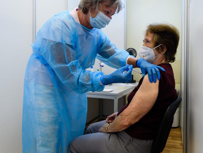 Medical staff inoculate an elderly patient with a booster of the Pfizer/BioNTech vaccine against Covid-19 on 15 September in Erfurt, Germany. Picture: Getty Images