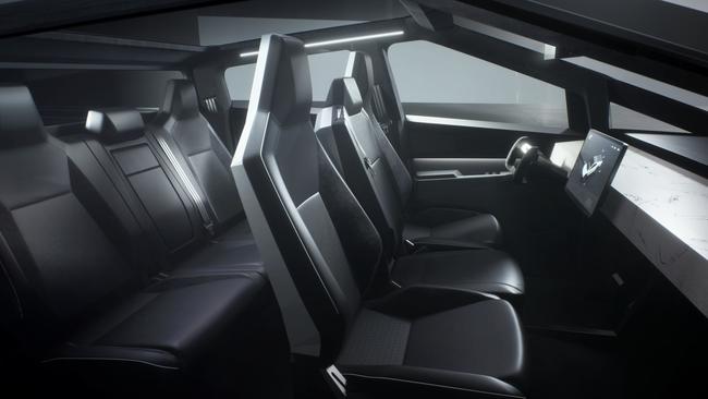 The interior maintains Tesla’s minimalist design.