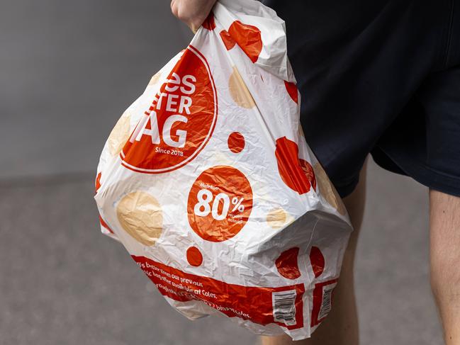 MELBOURNE, AUSTRALIA - NewsWire Photos October 15, 2021:  A person is seen carrying a Coles bag in Richmond, Melbourne, Victoria. Picture: NCA NewsWire / Daniel Pockett