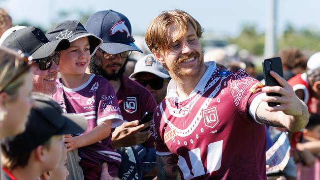 Cameron Munster takes a selfie with Queensland fans. Picture Lachie Millard