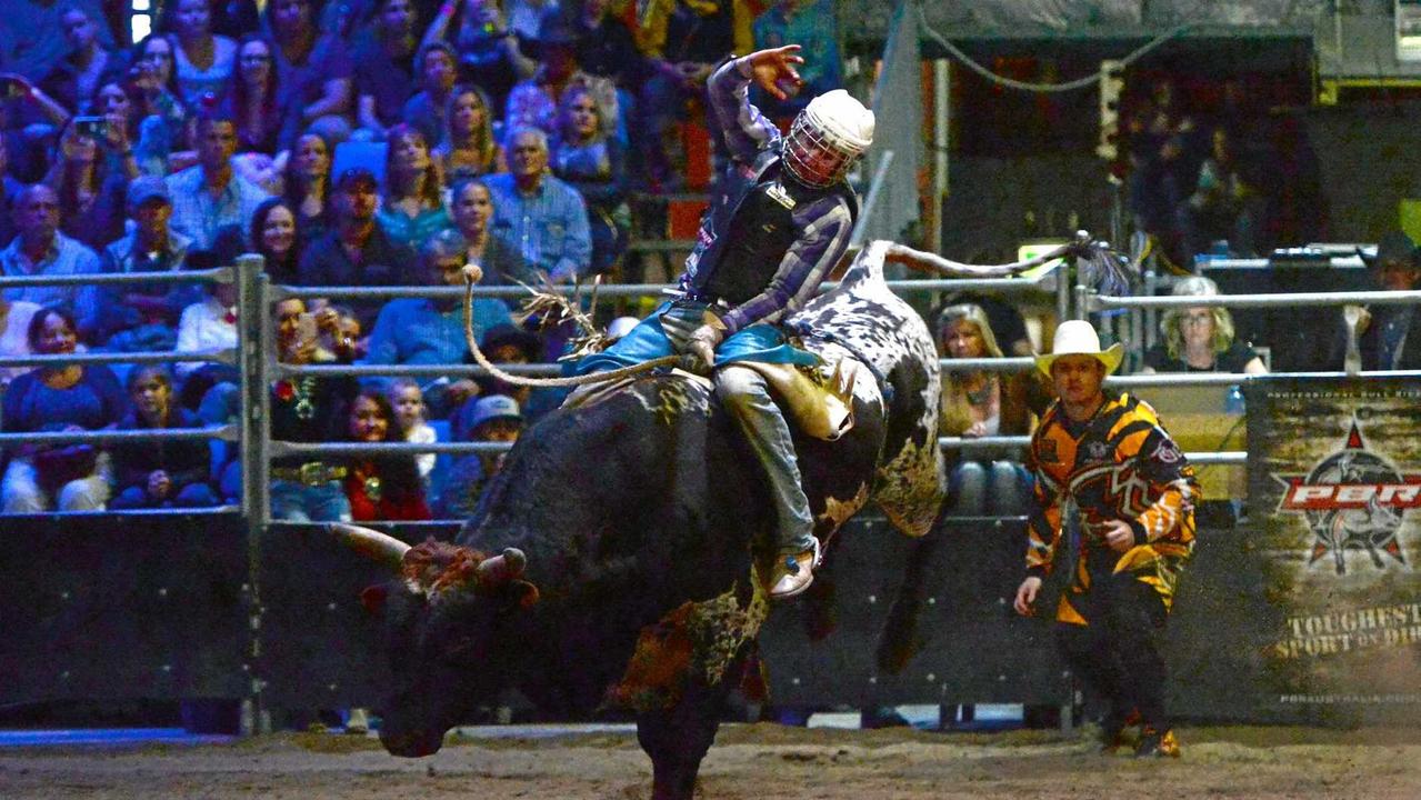 Aaron Kleier on Tenacious at the PBR bull riding event at the Great Western Hotel. Picture: Chris Ison