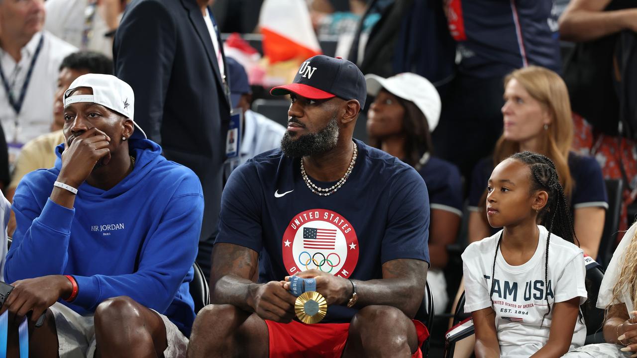 Bam Adebayo and LeBron James of Team United States attend the Women's Gold Medal game between Team France and Team United States on day sixteen of the Olympic Games Paris 2024 at Bercy Arena on August 11, 2024 in Paris, France. (Photo by Gregory Shamus/Getty Images)