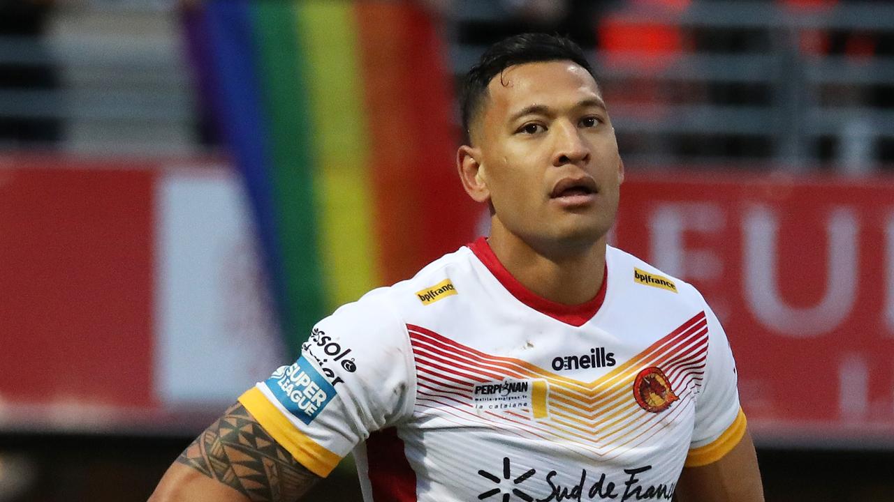 Protesters drape a rainbow flag over the stands in Israel Folau’s Super League debut.